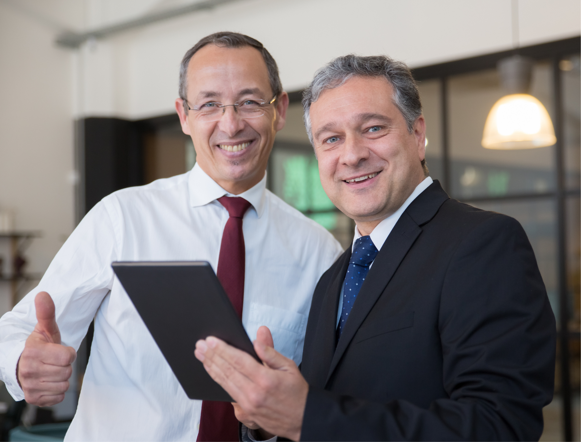 Two entrepreneurs celebrating a successful partnership deal.