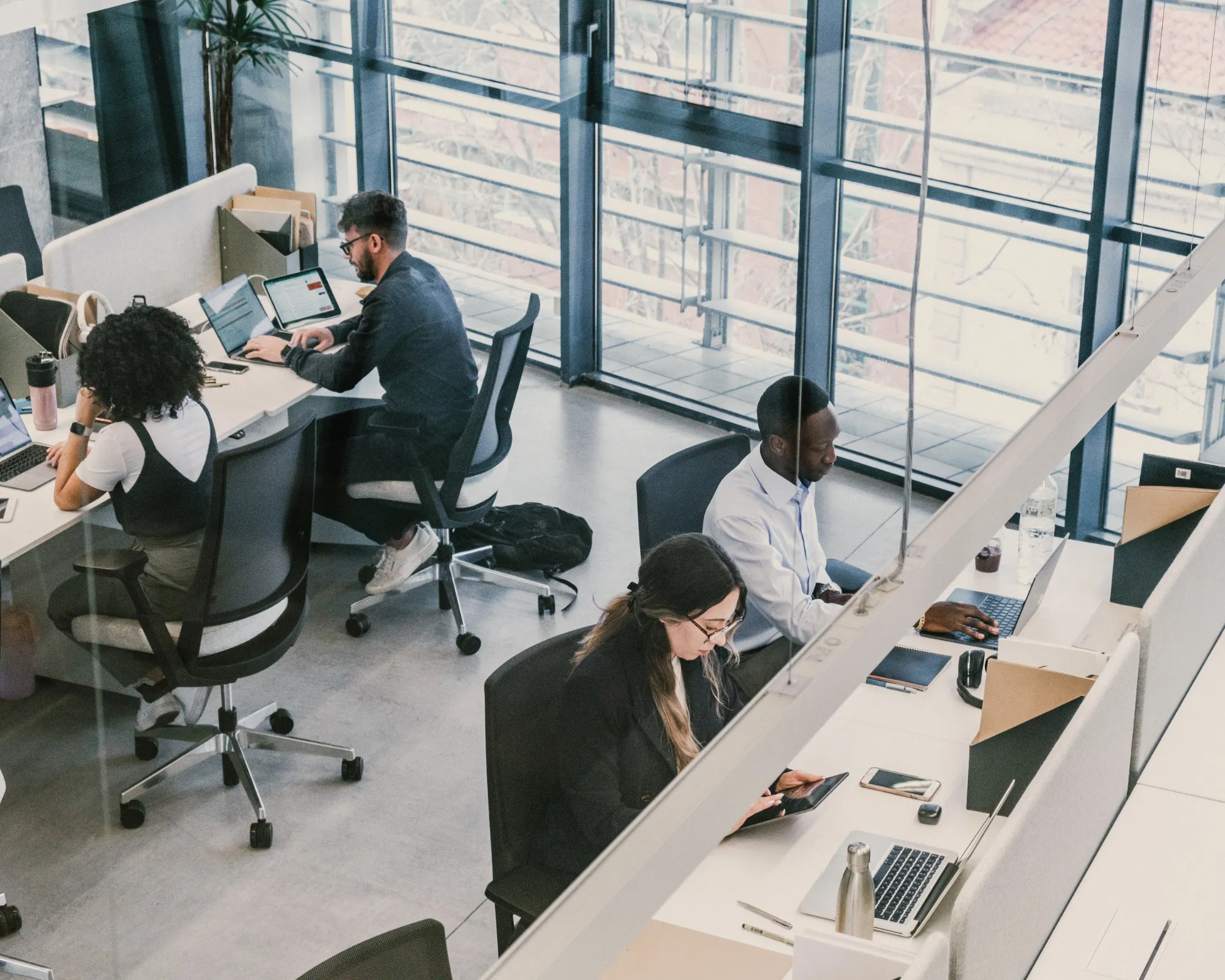 Diverse international team collaborating in a modern office at Iberian Tax